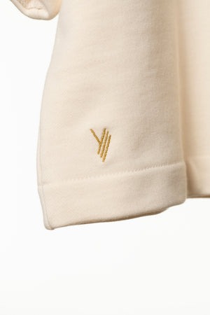 pull femme court et oversize manche 3/4 raglante, col rond en molleton, confortable blanc cassé